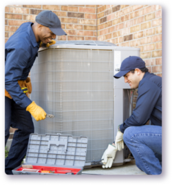 two technicians making a repair to an HVAC cooling unit