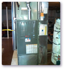 grey furnace in unfinished basement