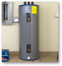 grey water heater on white brick wall