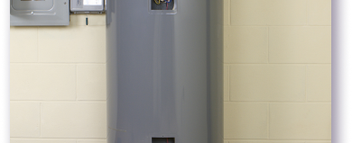 grey water heater on white brick wall
