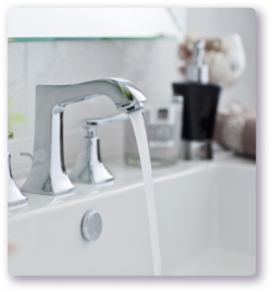 water running from faucet in bathroom sink